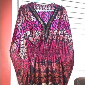 Woman’s blouse by BEBE front cut hand beaded polyester sleeveless open flare